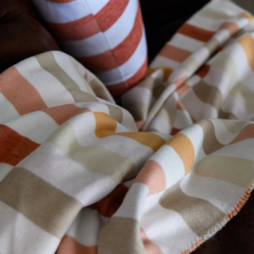 Close-up of Cinnabar and dark beige jacquard weave Bella Vita Sequence throw