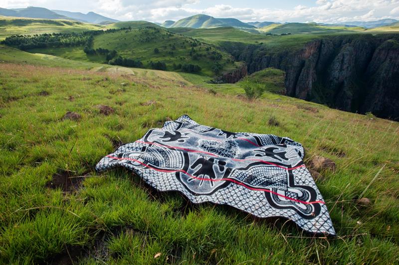 Blanket drying flat on grass in the Lesotho Highlands