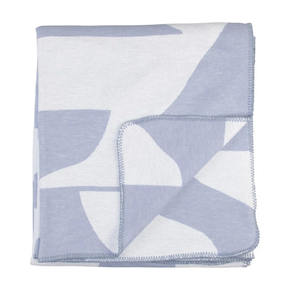 Folded blanket with geometric pattern on a white background