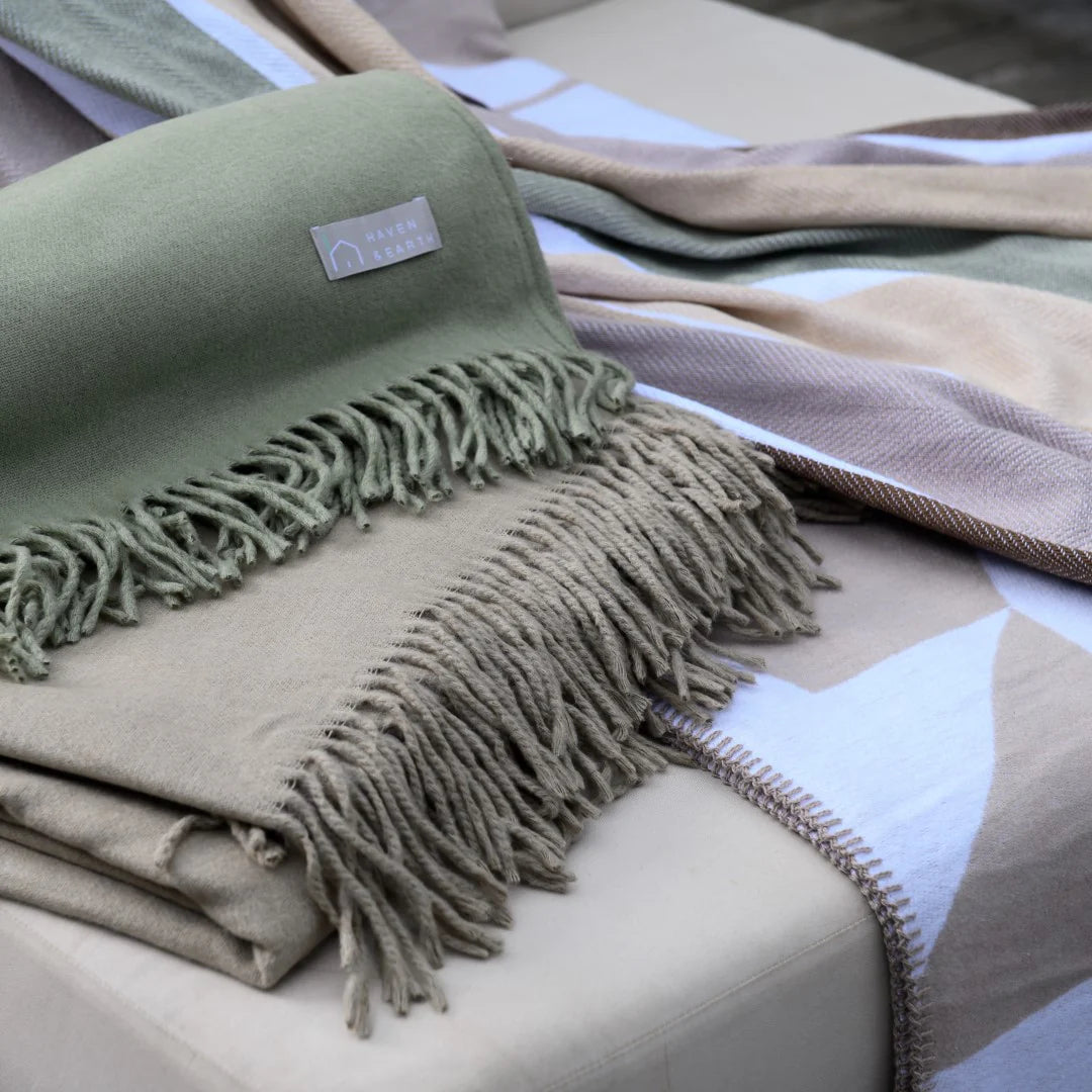 “Double-size Amanda Cotton Shapes Overcast Sky White throw as bed cover with neutral bedding”

“Grey-blue and white jacquard throw layered on bed in minimalist bedroom”