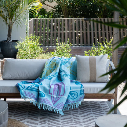 The Bella Vita Basotho My Africa Throw in Light Aqua/Kingfisher is a serene tribute to Africa's natural beauty. Featuring Basotho heritage patterns, this soft acrylic blanket offers lasting comfort and vibrant hues inspired by African rivers and skies.