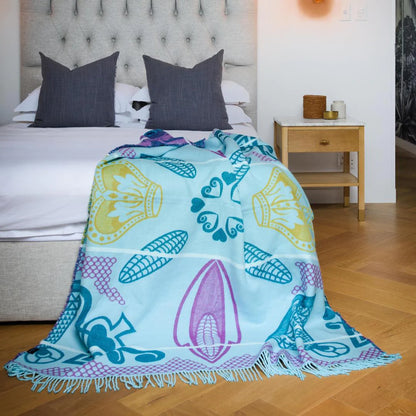 The Bella Vita Basotho My Africa Throw in Light Aqua/Kingfisher is a serene tribute to Africa's natural beauty. Featuring Basotho heritage patterns, this soft acrylic blanket offers lasting comfort and vibrant hues inspired by African rivers and skies.