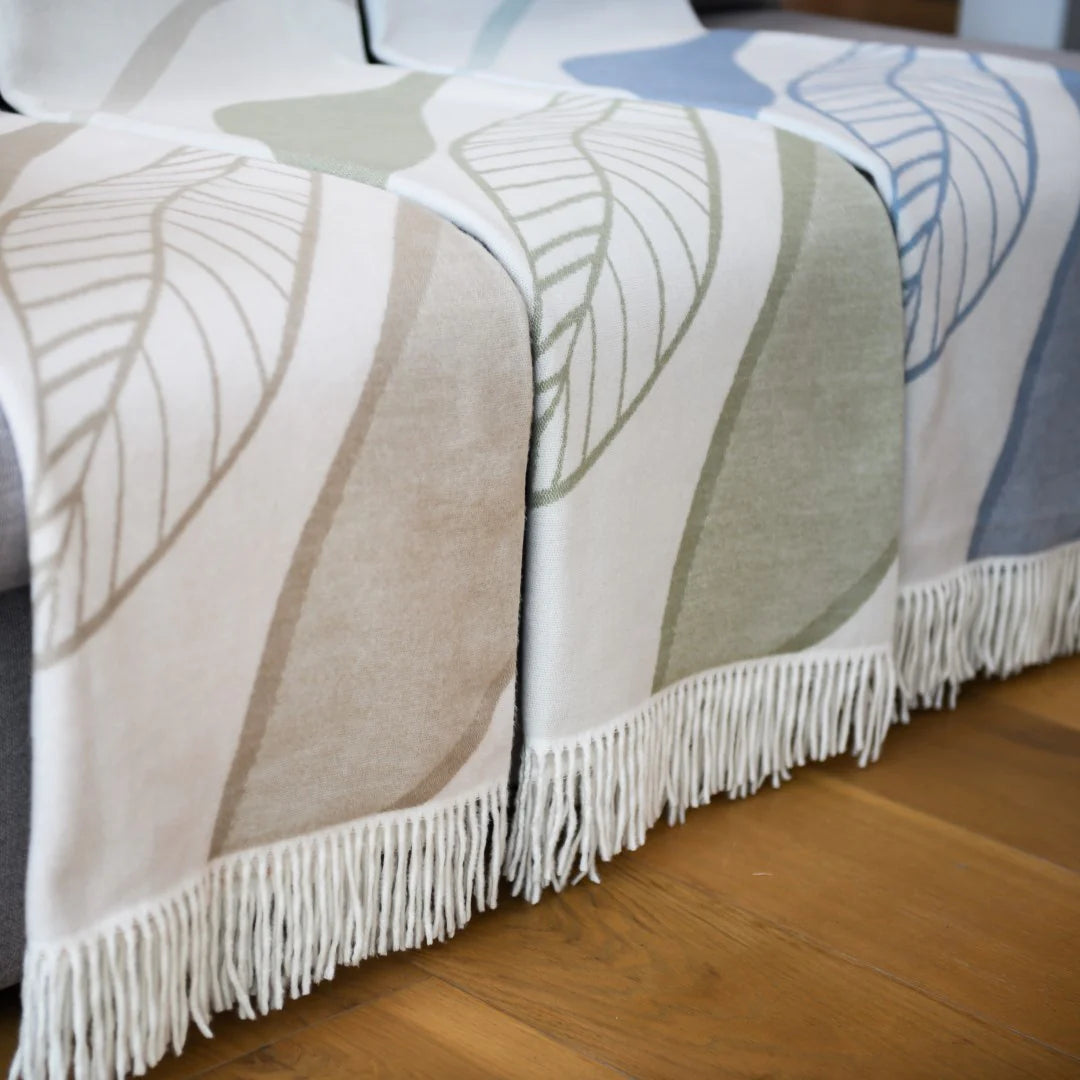 Overcast Sky-Eggshell Bella Vita Atrium throw draped over cozy modern sofa