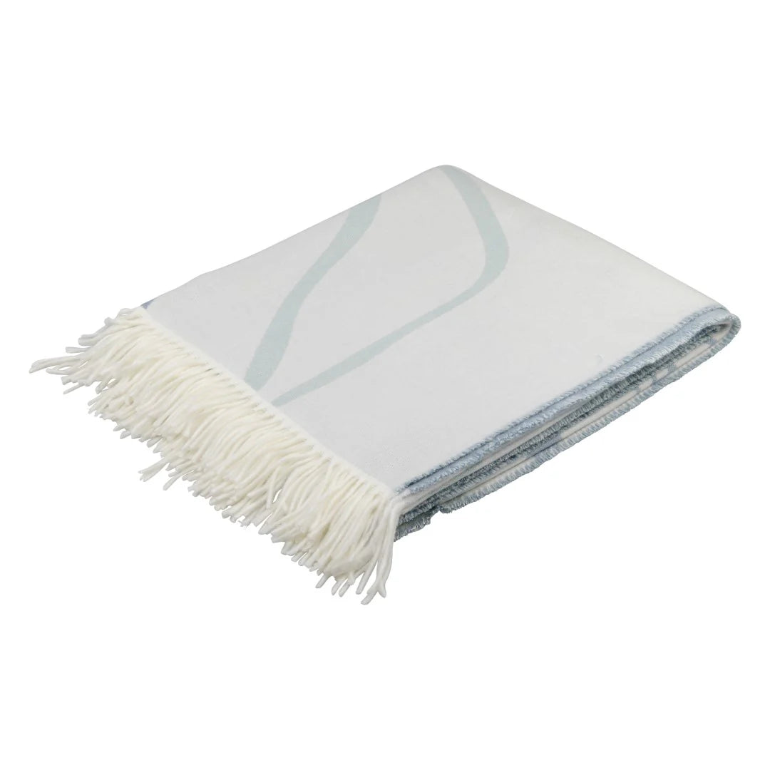 Folded Bella Vita Atrium Overcast Sky-Eggshell throw with white fringe on a white background