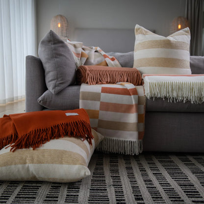 Bella Vita Sequence Cinnabar/Dark Beige throw draped over modern sofa