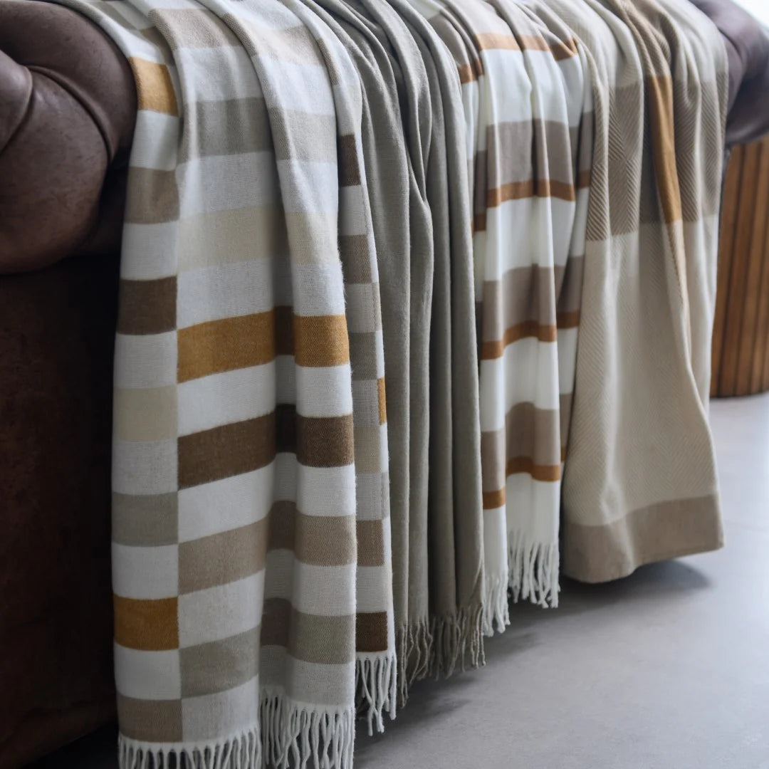 Bella Vita Sequence Coffee/Cobblestone throw draped on living room sofa