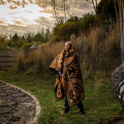 Luxurious Kharetsa Aloe blanket showcasing rich colors and heritage design.