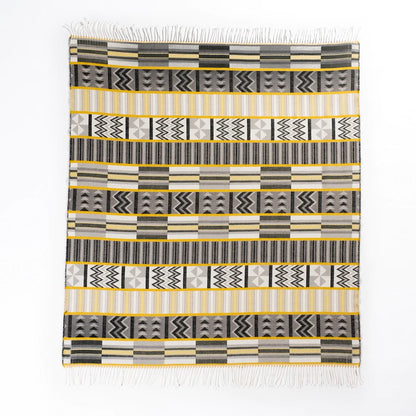 Bring African luxury into your home with the My Africa Bella Vita Kente Throw in Wild Dove/Nugget Gold. Featuring traditional Kente patterns, this soft acrylic blanket celebrates African royalty and craftsmanship, adding elegance and colour to any room.