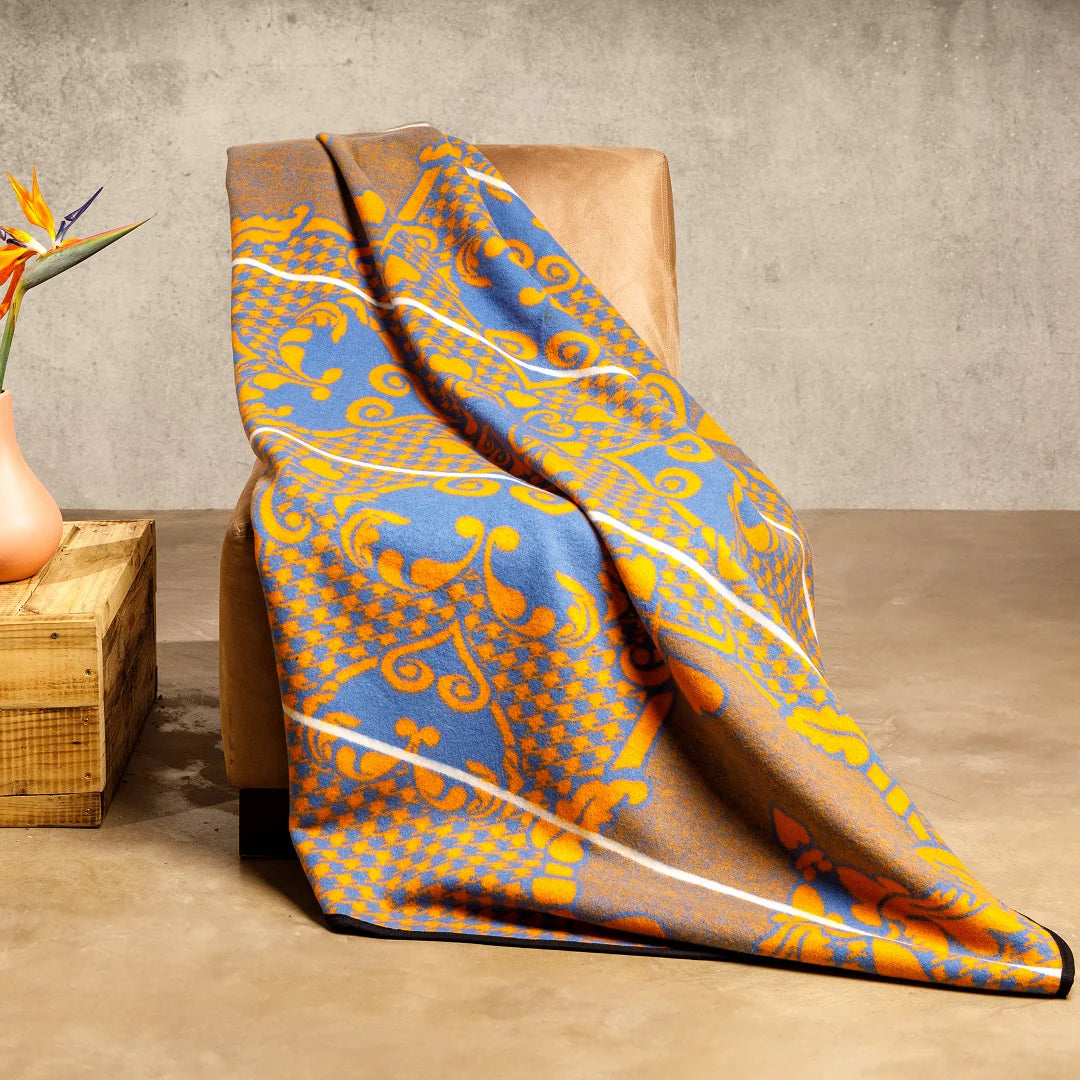 Motlatsi Khosana: The 50% wool royal blanket honoring Crown Prince Lerotholi. Features 60 Basotho heart motifs symbolizing loyalty. Colorfast, non-pill, ethically woven in SA. Includes care instructions.