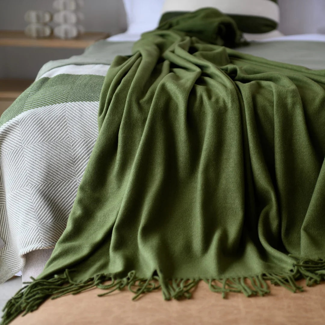Hunter plain throw layered on bed
