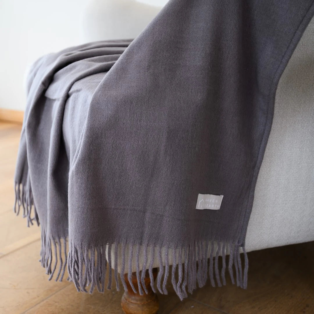 Iron Melody throw styled on contemporary sofa