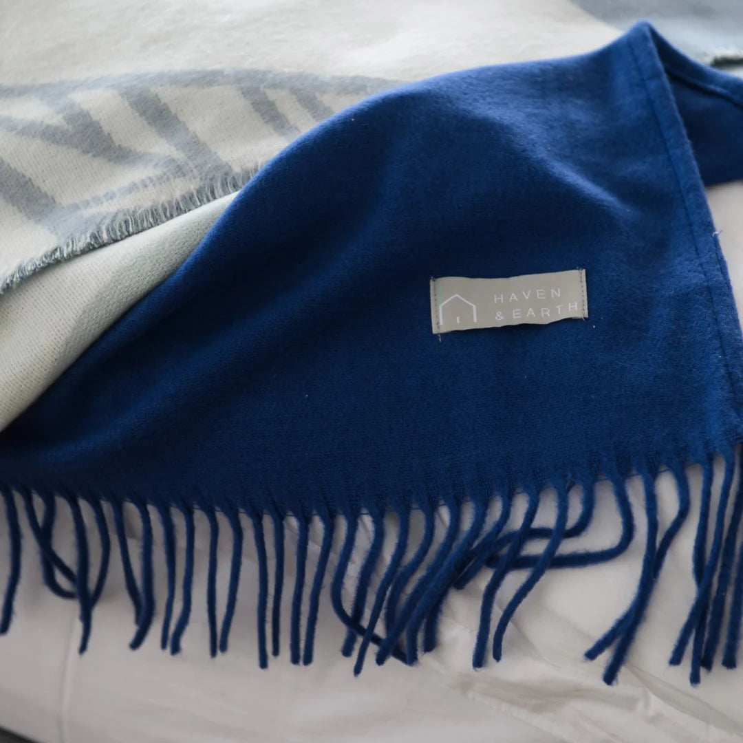 Close-up of midnight blue Melody plain throw texture