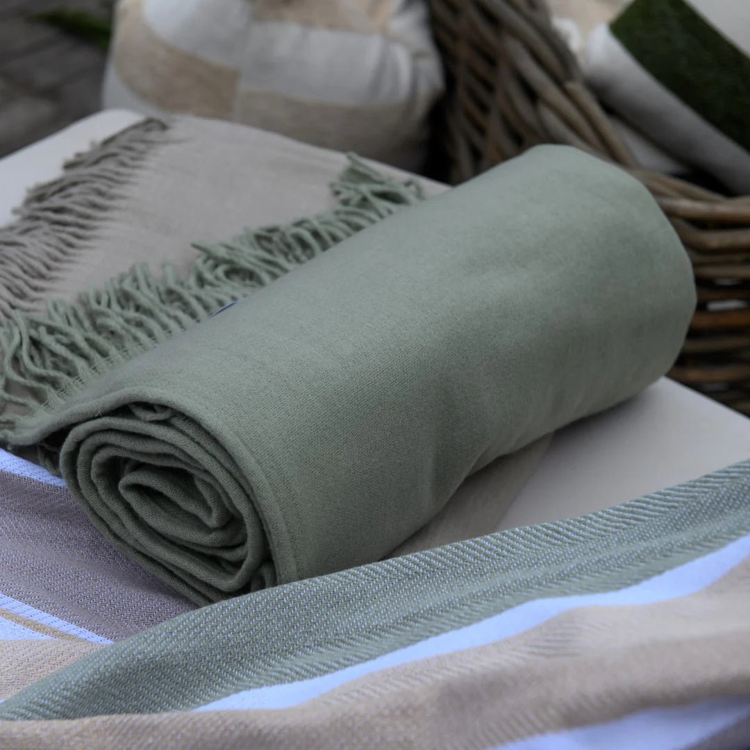 Close-up of olive green Melody plain throw texture