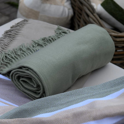 Close-up of olive green Melody plain throw texture