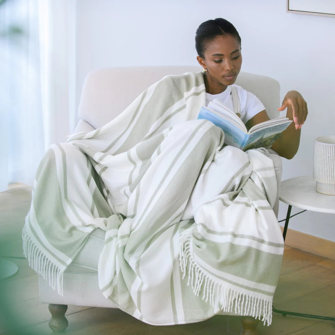 Haven & Earth Melody Runway throw in Olive/Natural – bold striped, lightweight acrylic, 150 × 200 cm.