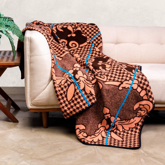 Motlatsi Khosana blanket draped over chair showing 60 heart motifs honoring Basotho royalty
