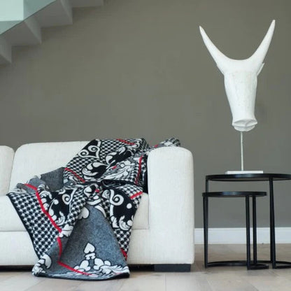Motlatsi Khosana: The 50% wool royal blanket honoring Crown Prince Lerotholi. Features 60 Basotho heart motifs symbolizing loyalty. Colorfast, non-pill, ethically woven in SA. Includes care instructions.