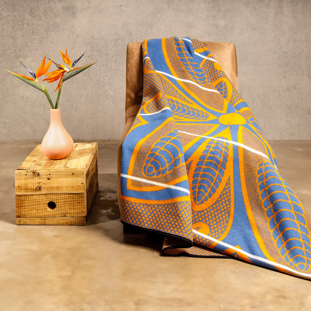 Sefate Basotho Blanket: Vibrant geometric patterns in red, blue, yellow, and green symbolize love, fertility, and heritage. Perfect for cultural ceremonies and home decor