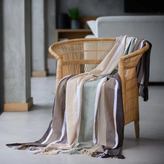Protea Pinstripe Sunset throw in Cocoa/Coffee – cozy striped design with hand-knotted fringes.