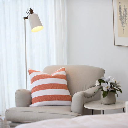 Protea Chenille Scatter Cushion in Canyon and White, 55x55 cm, soft chenille texture, styled on a contemporary armchair.