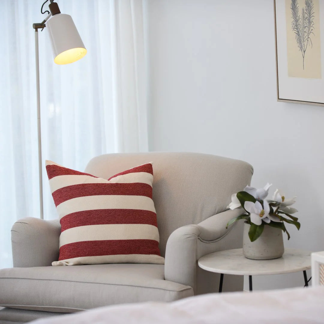 Protea Chenille Scatter Cushion in Garnet and Natural, 55x55 cm, textured chenille, in a living room setting.