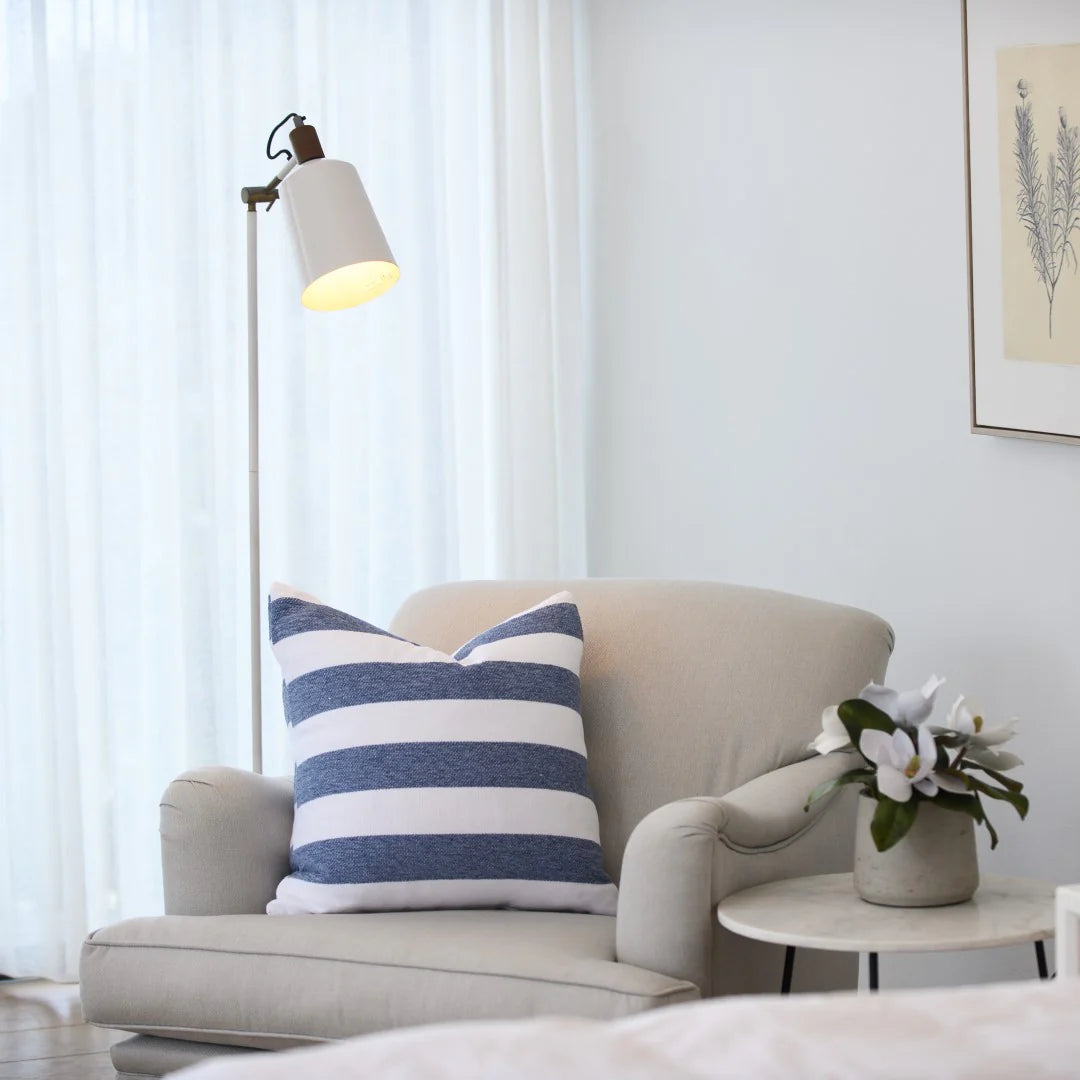 Protea Chenille Scatter Cushion in Overcast Sky and White, 55x55 cm, soft chenille texture, styled on a minimalist sofa.
