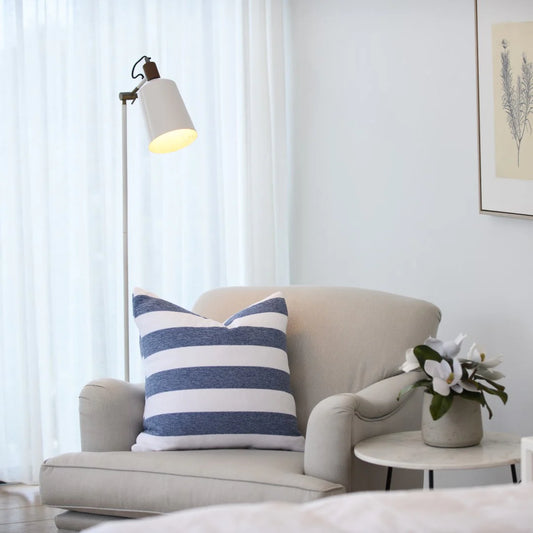 Protea Chenille Scatter Cushion in Overcast Sky and White, 55x55 cm, soft chenille texture, styled on a minimalist sofa.