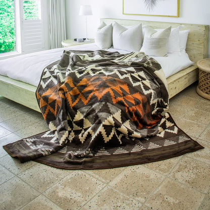 The Zulu Basket Throw in Cocoa/Bone showcases rich tradition in warm neutrals. A perfect blend of culture and comfort from the My Africa Collection.