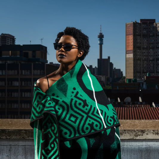 Celebrate love & elegance with the Majaba-Jaba Wool Blanket—a 50% wool, 50% acrylic masterpiece symbolizing devotion, leadership & African heritage. Handcrafted with passion. Perfect for gifting or luxury home décor.