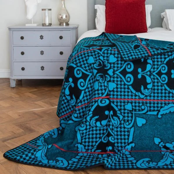 Motlatsi Khosana: The 50% wool royal blanket honoring Crown Prince Lerotholi. Features 60 Basotho heart motifs symbolizing loyalty. Colorfast, non-pill, ethically woven in SA. Includes care instructions.